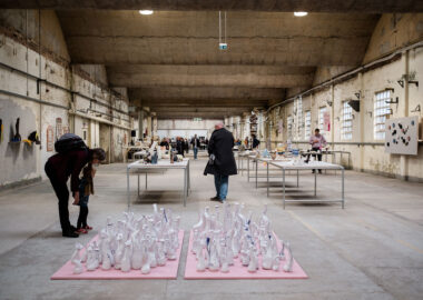 Visitors look at ceramic art being exhibited at British Ceramics Biennial 2019 in Spode China Hall.