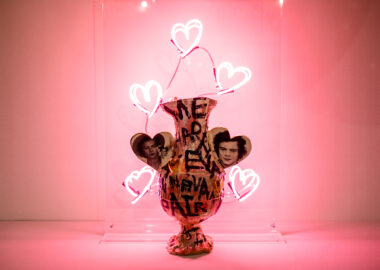 Ceramic jug with images of Harry Styles on it, surrounded by neon lights shaped like hearts. Work by Connor Coulston, Award Exhibitor at British Ceramics Biennial 2021