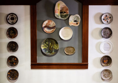Selection of decorated plates on display at British Ceramics Biennial 2021.