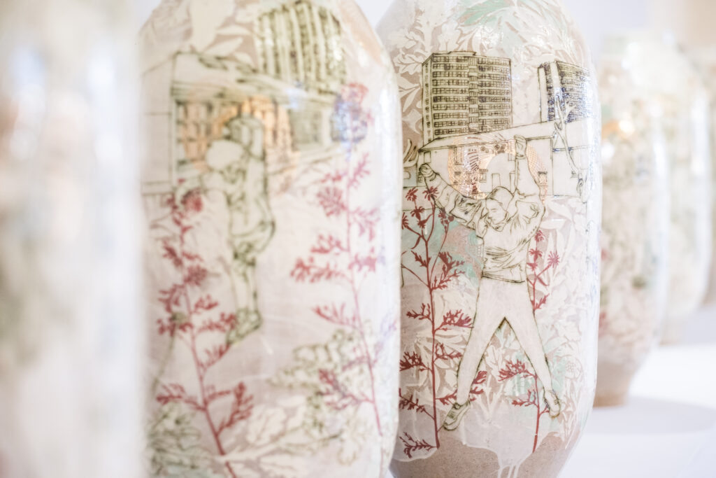 Intricately patterned clay vessels that are part of Emilie Taylor's work at the 2023 British Ceramics Biennial.