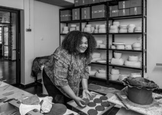 Chi Onwordi with her ceramic work during her Fresh Talent Residency in Boleslawiec, Poland.
